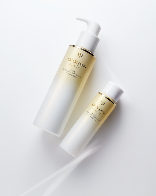 Photo of two sizes of “CLEANSING OIL.” The left is the 200mL bottle with a white pump, and the right is the 75mL bottle with a cap.