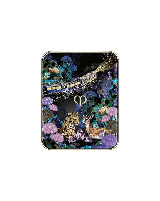 Photo of the compact case of the limited-edition EYE COLOR QUAD featuring a special design with a train, animals, and flowers, showing a gold train running across the lid. Includes two tips and a brush. Shade: Pastel Tea Safari.