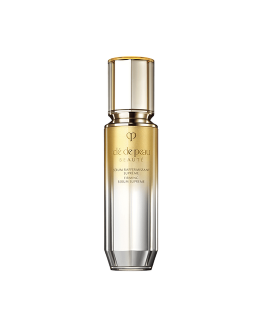 Photo of a "FIRMING SERUM SUPREME bottle with a gradient design transitioning from gold at the top to silver at the bottom. SIZE : 40ml
