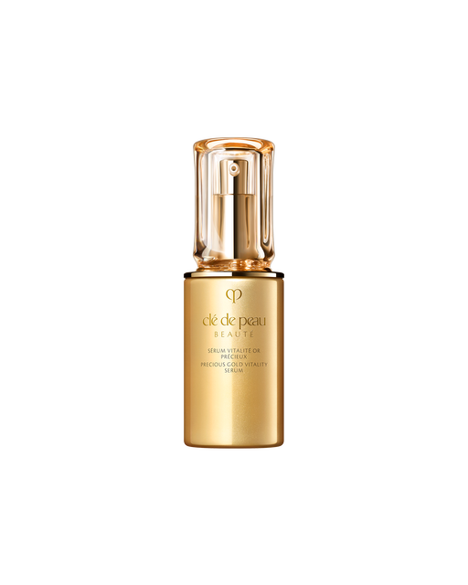 Photo of "PRECIOUS GOLD VITALITY SERUM", featuring a glossy gold bottle paired with a thick, translucent cap. The front displays the brand logo and product name in an elegant design.