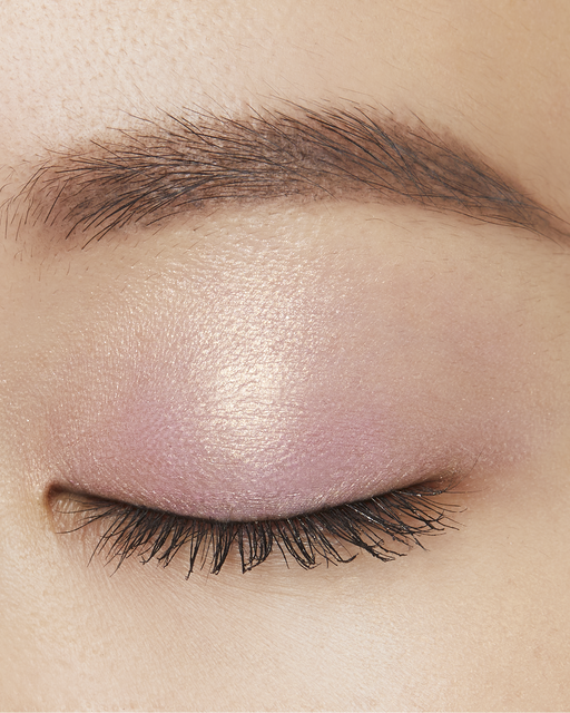 Photo of the EYE COLOR SOLO Shade: 101-Pink Ocean Dawn applied to the eyelids of a model with medium skin tone.