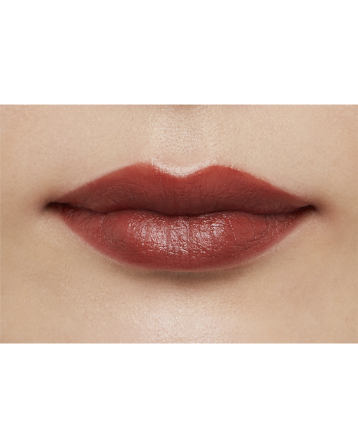 Photo of a medium skin tone model  wearing "LIPSTICK MATTE" in High Achieve on the lips.