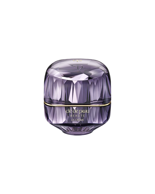 Photo of the limited-edition LA CRÈME in a jewel-like cut jar with a translucent purple finish. The front features the brand logo and LA CRÈME lettering. SIZE: 30ml