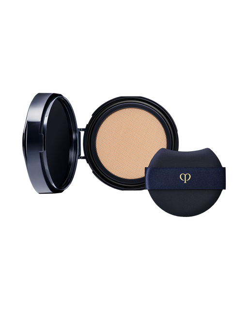 Photo of an open "RADIANT CUSHION FOUNDATION NATURAL (Refill)" compact with a branded puff. SHADE: O20