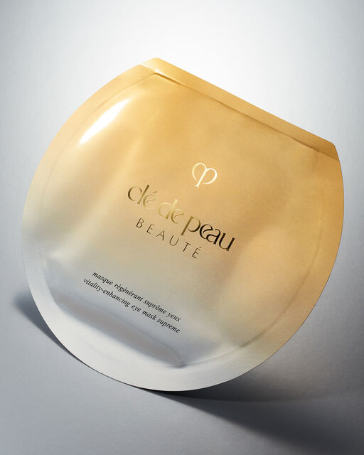 Photo of the eye masks's gold gradient pouch package.
