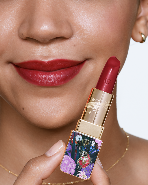 Photo of a deep skin tone model wearing LIPSTICK Ruby’s Spark on the lips.