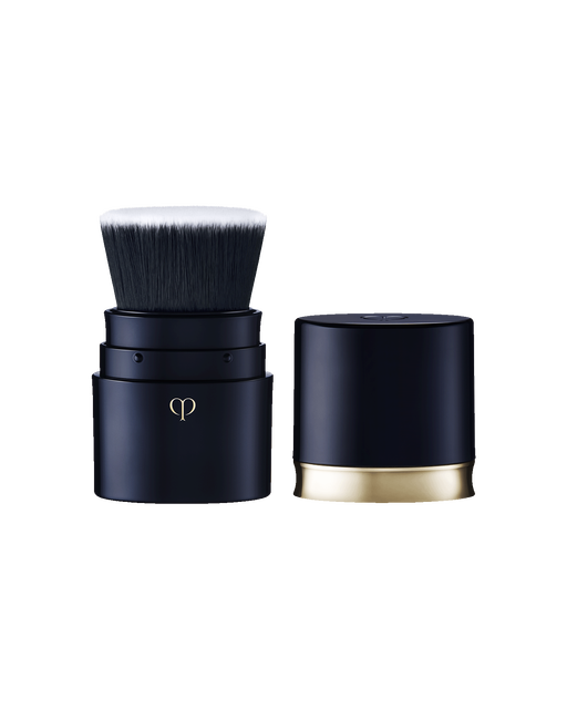 Photo of “PORTABLE BRUSH" with a blue-black body and gold brand logo engraved on it. The cap is removed.