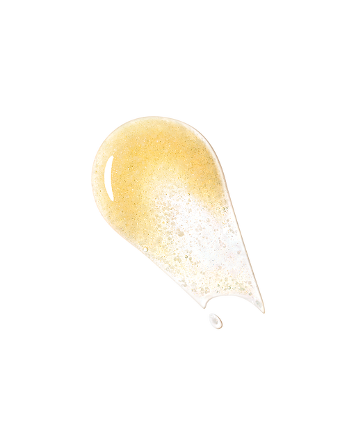 Photo of the texture, showing a thick, clear serum with fine, shimmering gold pearls suspended throughout.