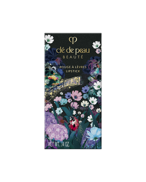 Photo of the special outer box for the limited-edition LIPSTICK featuring a vibrant floral design with a ladybug and botanical elements.