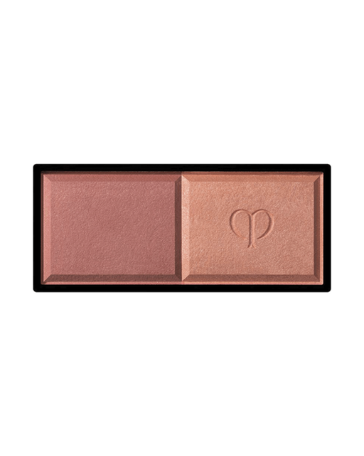 Photo of the rectangular "POWDER BLUSH DUO (Refill)" featuring two powders side by side. The left side has a matte texture, and the right side is a delicate pearly powder embossed with a logo in the center. Shade: 105