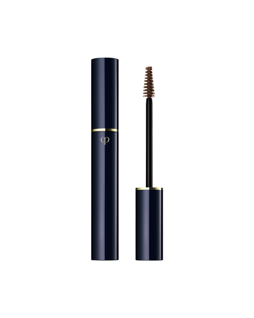 Photo of "EYEBROW GEL". The slim blue-black body is engraved with the gold brand logo, and the cap has a brush attached to it. Shade: 102-Dark Brown.