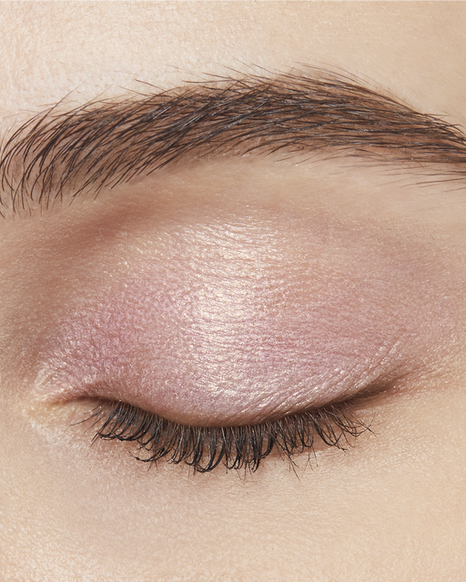 Photo of a light skin tone model  wearing EYE COLOR SOLO in 101-Pink Ocean Dawn on the eyes.