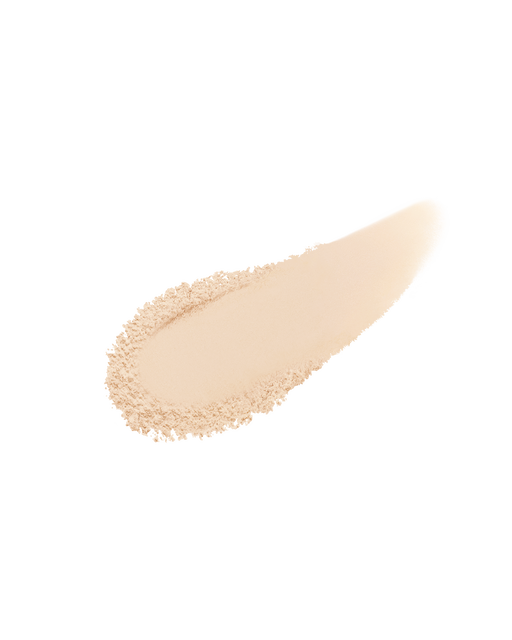 Photo of a finely-textured powder foundation spread out in a single brush stroke. SHADE: I10.