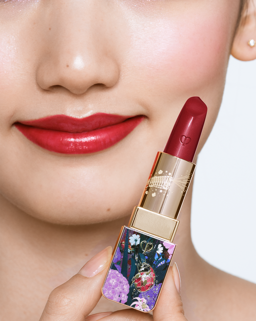 Photo of a medium skin tone model wearing LIPSTICK Ruby’s Spark on the lips.