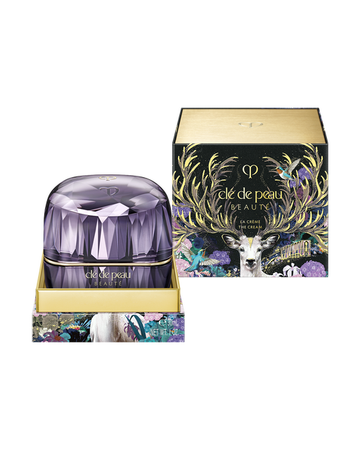 Photo of the limited-edition LA CRÈME displayed alongside its special outer box, decorated with vibrant illustrations of a deer and flowers.