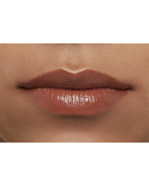 Photo of a deep skin tone model  wearing  "LIPSTICK" in Amberkiss Pansy on the lips.