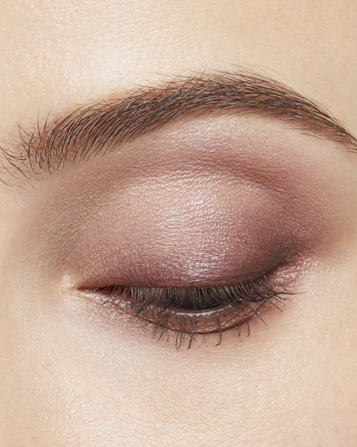 Photo of a light skin tone model wearing EYE COLOR QUAD in 3-Sundried Driftwood on the eyes.