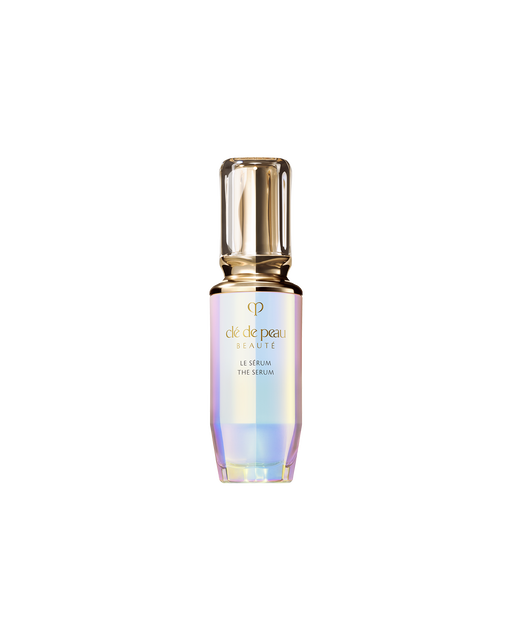 Photo of "THE SERUM" bottle with an iridescent finish and a rounded, translucent gold cap. SIZE: 50ml