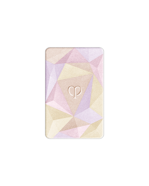 Photo of the limited-edition THE LUMINIZING FACE ENHANCER Radiant Peafowl refill with geometric patterns in blue, lavender, and light gold. The brand logo is engraved in the center.