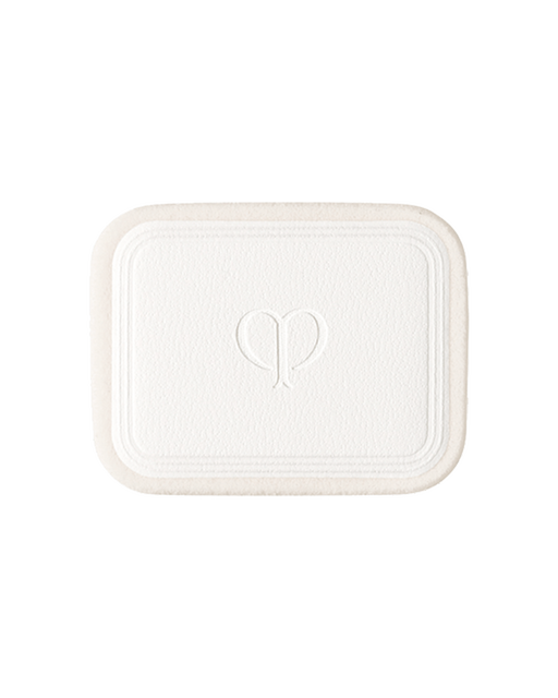 Photo of a sponge for "BRIGHTENING POWDER FOUNDATION". It is rectangular with the brand logo engraved in the center.