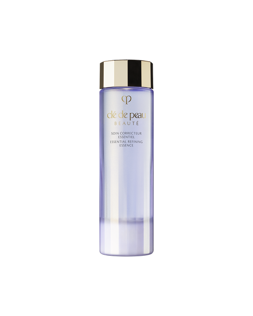 Photo of the "ESSENTIAL REFINING ESSENCE" in a clear, pale purple bottle with a gold cap.