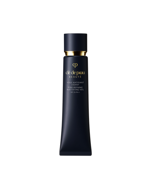 Photo of "PORE-REFINING MATTIFYING VEIL", in a slim blue-black tube accented with a reflective gold cap and the brand logo.