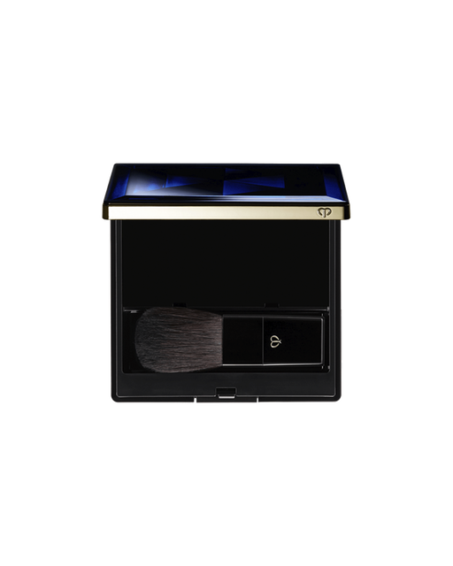 Photo of an exclusive case for the "POWDER BLUSH DUO" with the lid open. The interior includes a space for storing the refill and a brush featuring the brand logo.