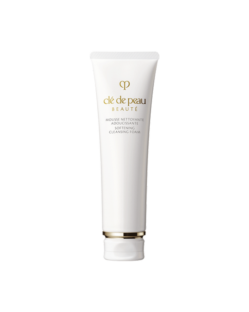 Photo of a white tube of “SOFTENING CLEANSING FOAM.” Gold brand logo and product name are printed on the front. The cap features gold detailing. Size: 140g.