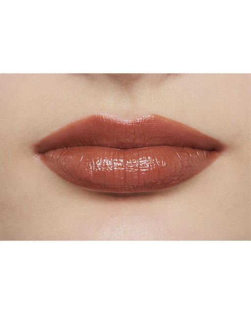 Photo of a light skin tone model  wearing  "LIPSTICK" in Amberkiss Pansy on the lips.