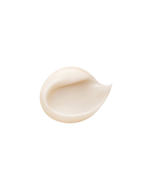 A photo of a glossy, smooth, milky-white cream texture.