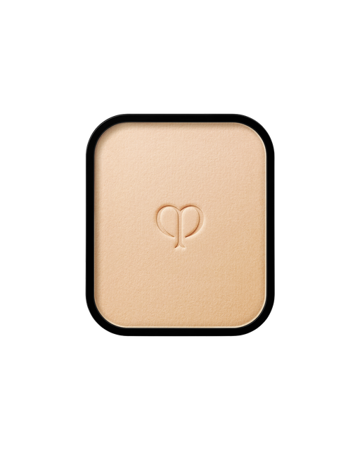 Photo of a refill of "RADIANT POWDER FOUNDATION" with an embossed brand logo in the center. SHADE: I10.
