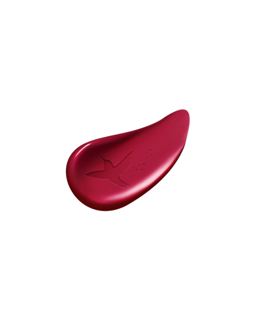 Photo of the limited-edition LIPSTICK Ruby’s Spark swatch showing a smooth texture with a bird motif embossed on the surface.