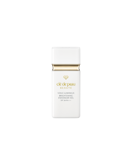 Photo of "BRIGHTENING ENHANCER VEIL" in a sleek, minimalist white bottle featuring a gold accent and brand logo at the center.