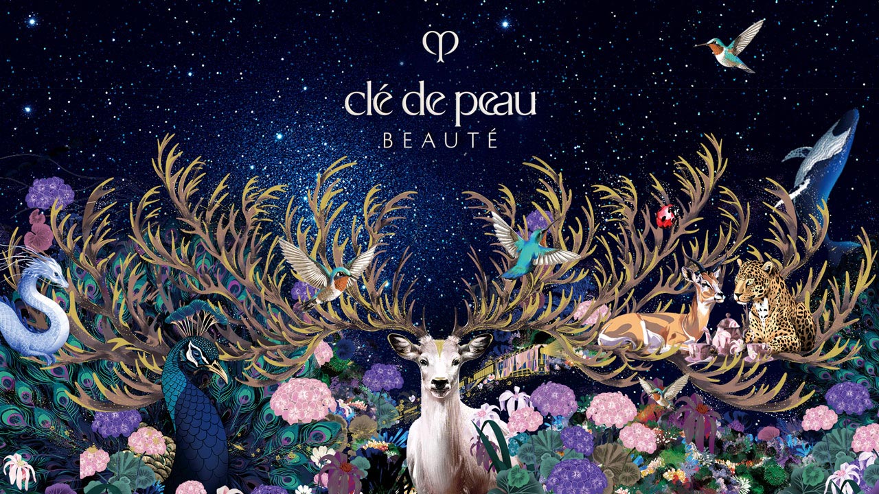 Wallpaper of a dreamy illustration featuring a white deer with golden antlers, animals, and flowers under a starry sky, with the Clé de Peau Beauté logo at the top center.
