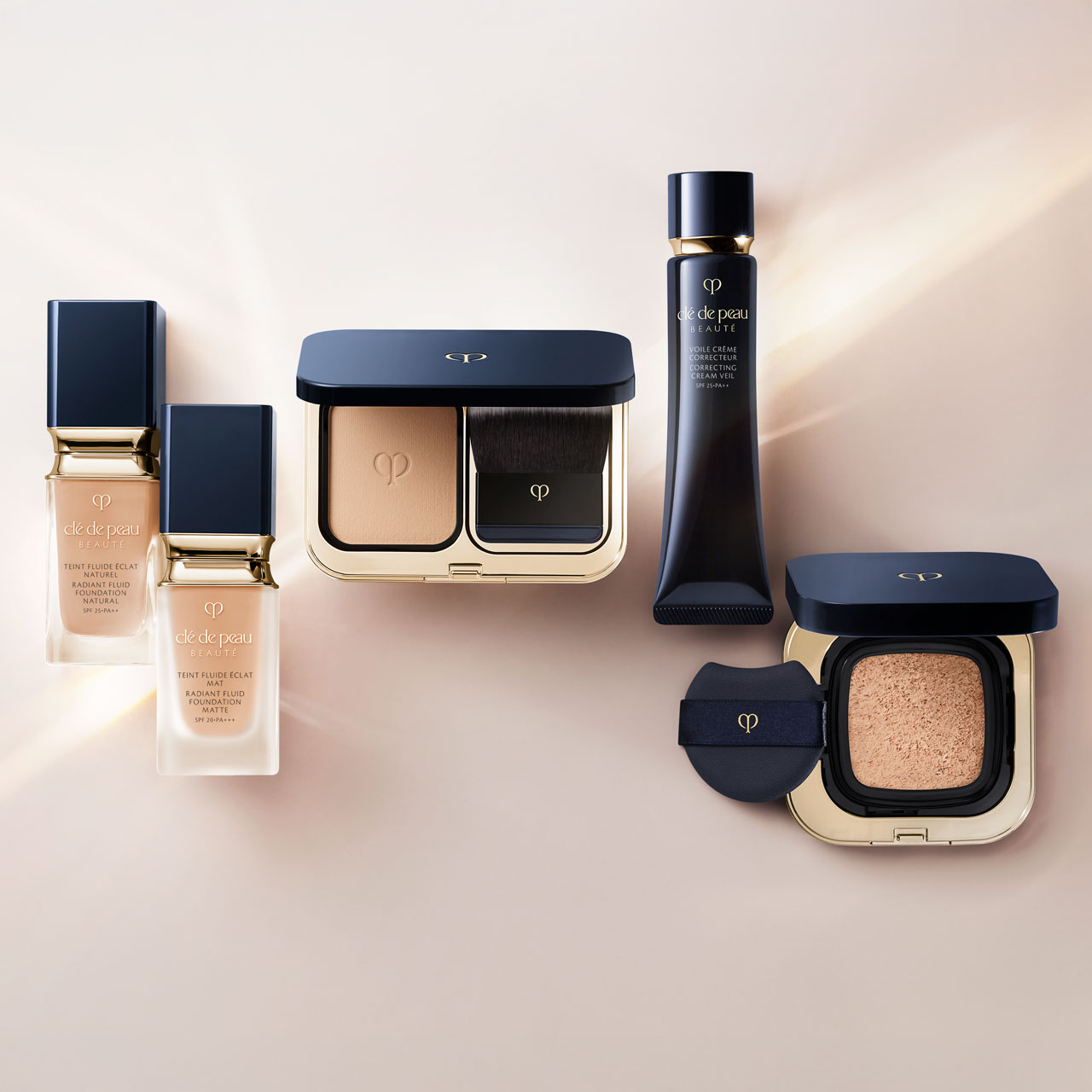 Photo of Radiant Fluid Foundation (Natural, Matte), Radiant Powder Foundation, Radiant Cream Foundation, and Radiant Cushion Foundations displayed together on a soft beige background.