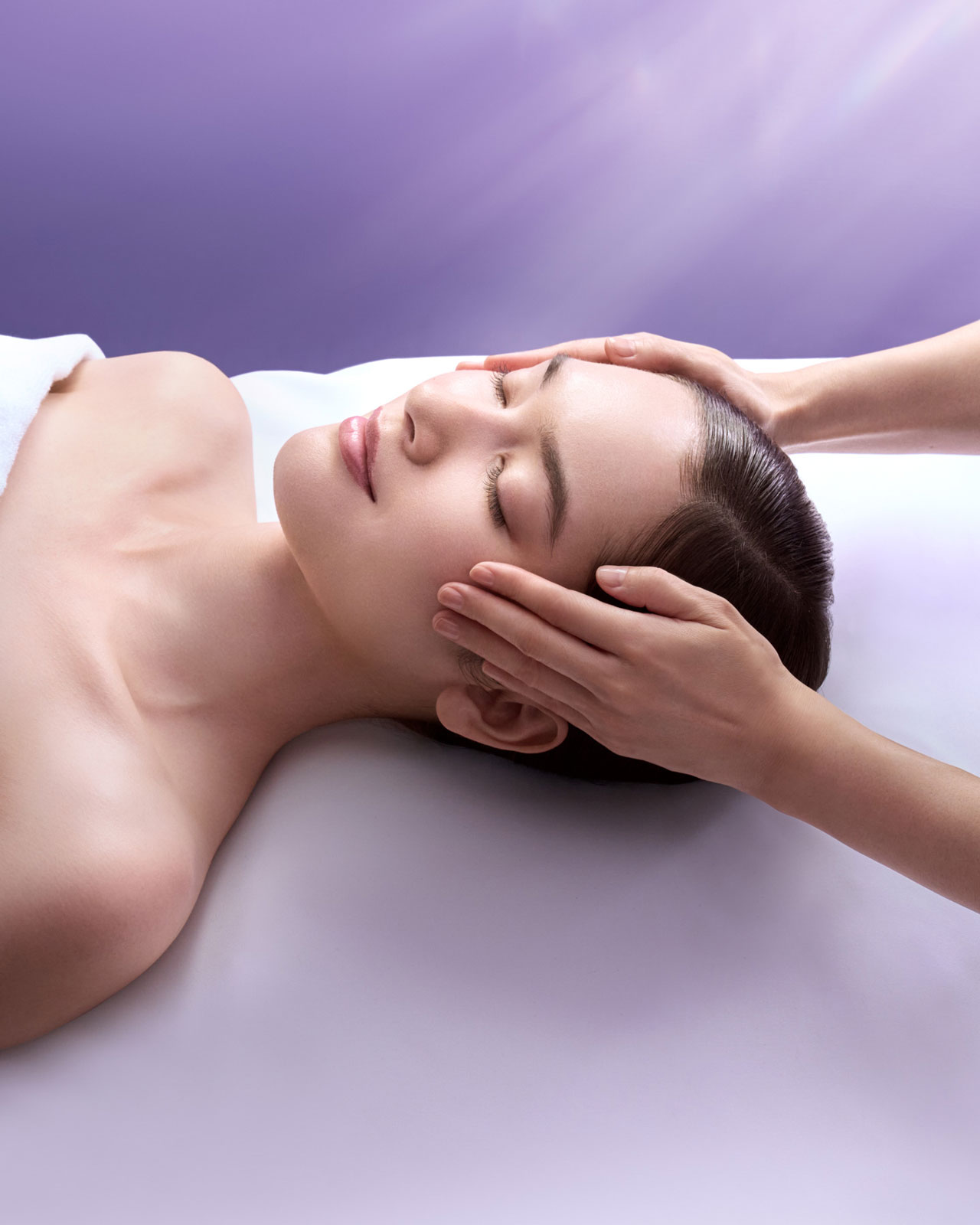Photo of a woman receiving a professional facial massage.