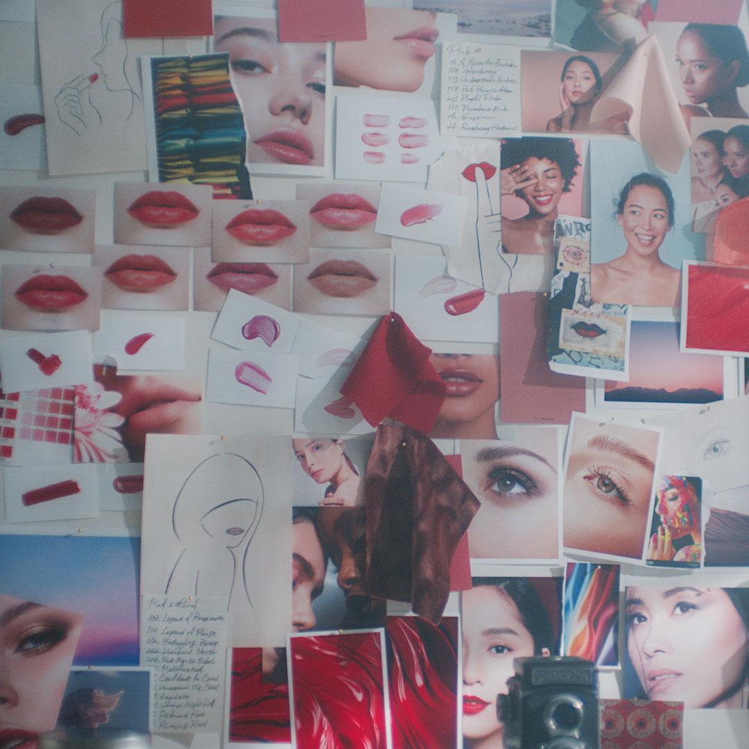 Photo of a creative collage at Benjamin Puckey’s atelier, showcasing lip makeup, portraits, and artistic sketches.