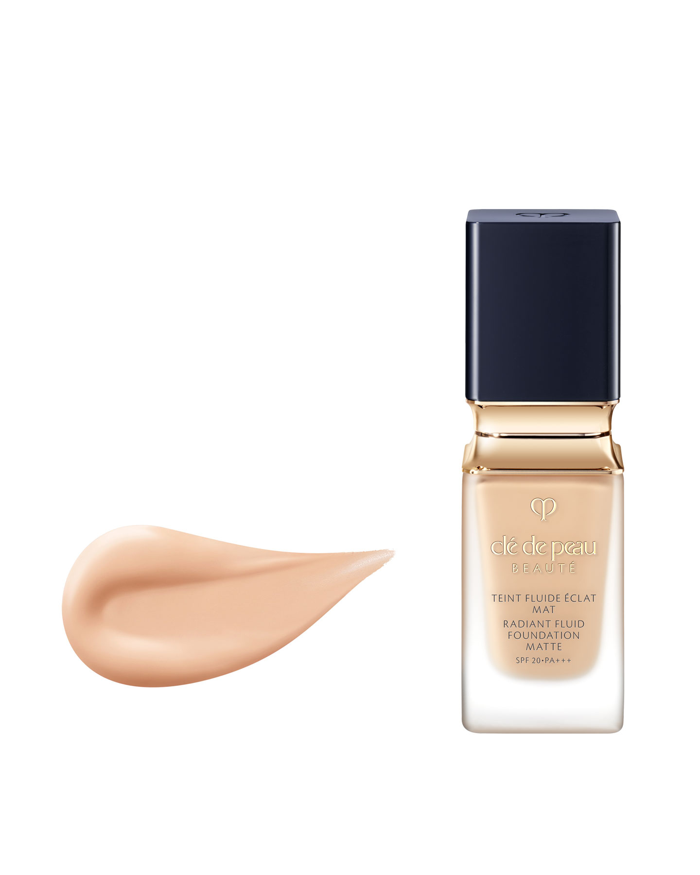 Photo of a RADIANT FLUID FOUNDATION MATTE bottle with gold accents and a blue-black cap, alongside a smooth, dewy beige texture.