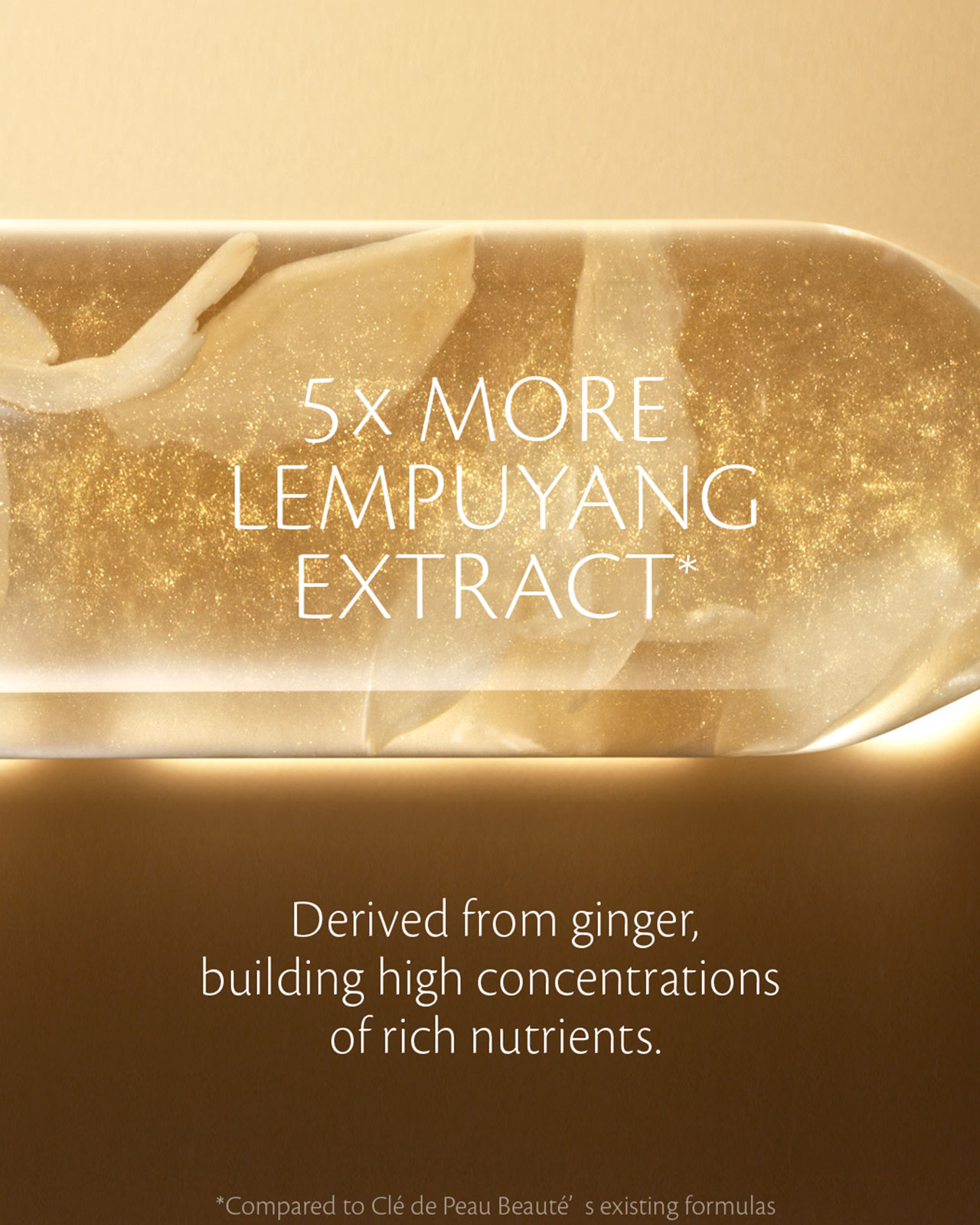 Photo of a gold-colored capsule with shimmering particles, featuring the texts: “5x MORE LEMPUYANG EXTRACT” and “Derived from ginger, building high concentrations of rich nutrients.”