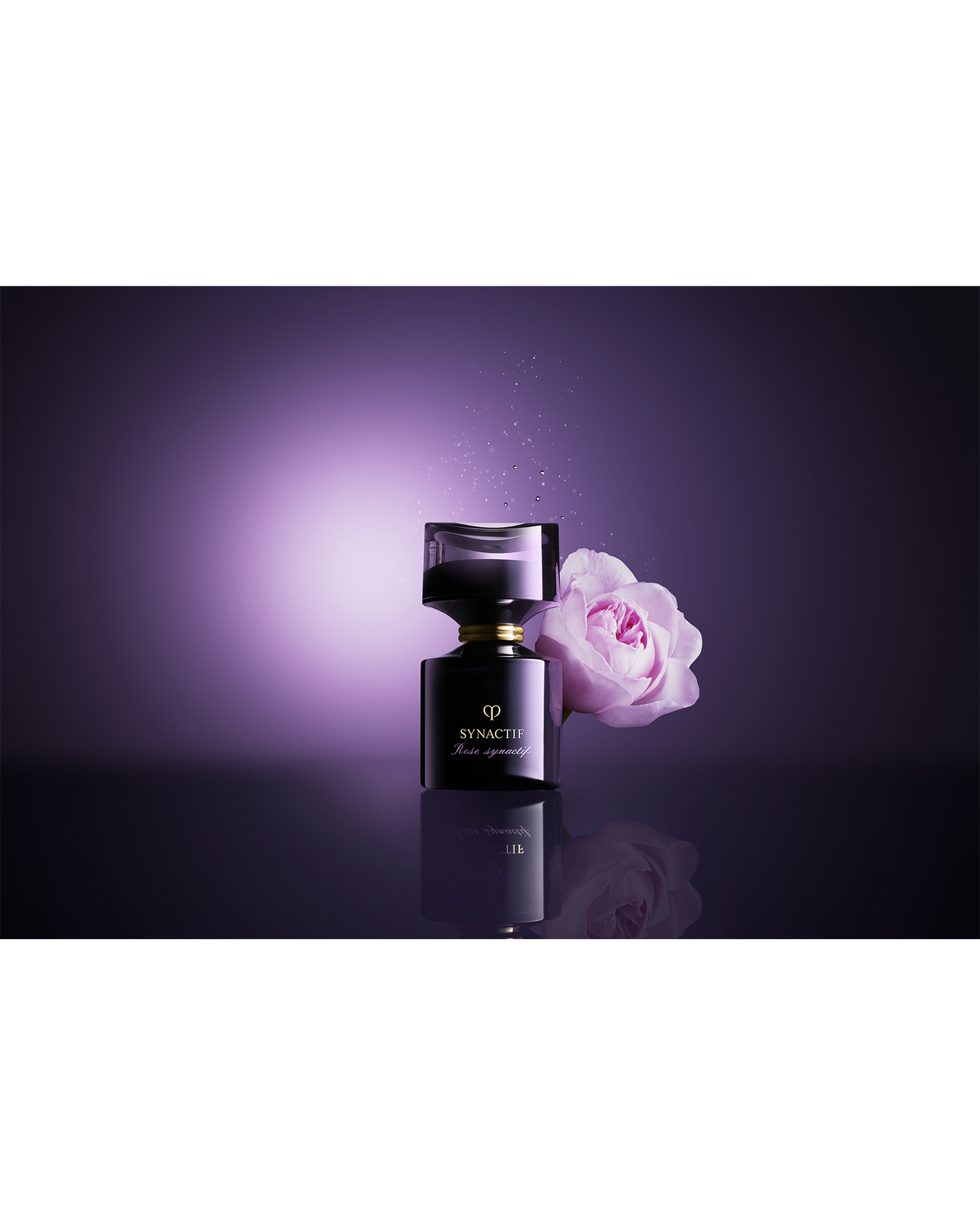 Photo of  a pale pink rose placed beside  black ROSE SYNACTIF bottle.
